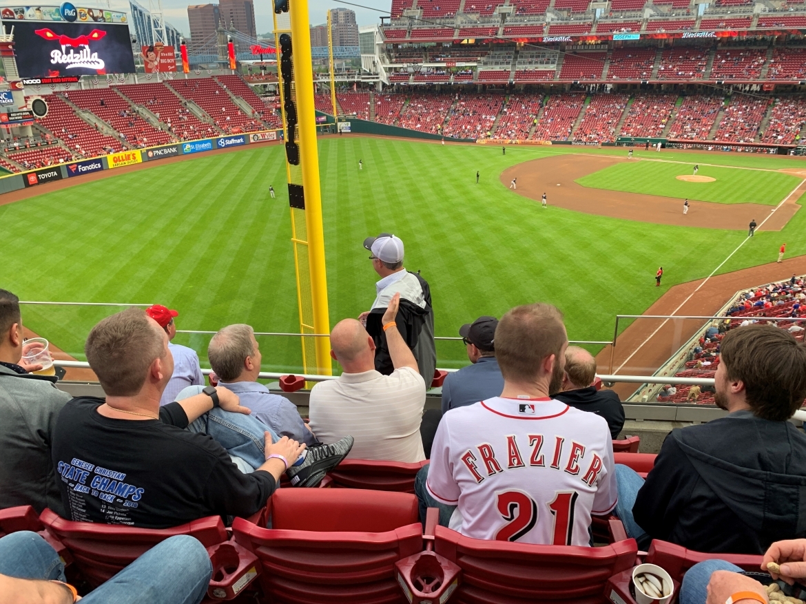Men watching a baseball game